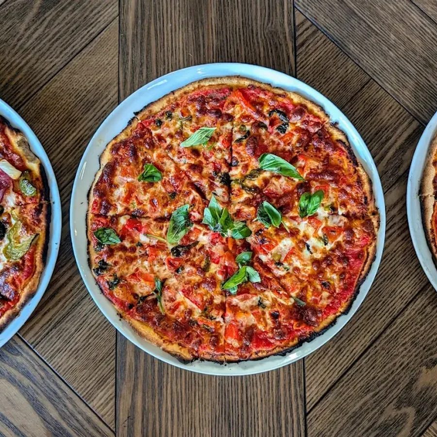 Three pizzas on the table